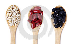 Flat lay of arranged wooden spoons with various healthy seeds in mix