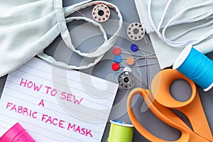 Flat-lay arrangement of supplies needed to sew a fabric face mask