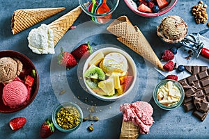 Flat lay of assorted ice cream with ingredients