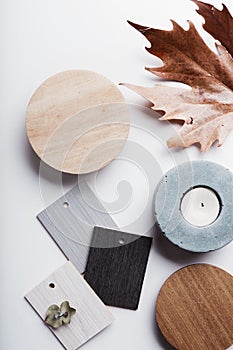 Flat lay of autumn grey and warm tone interior finishes photo