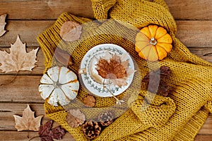 Flat lay Autumn still life with a coffee cup and pumpkins