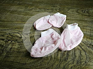 Flat Lay of baby apparel on rustic wood background