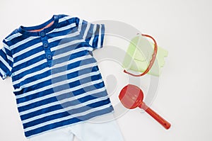 flat lay baby clothes with toys. High quality photo