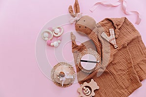 Flat lay Baby shower, newborn child accessories on pink background,