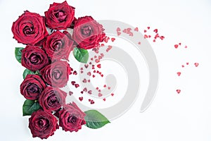 Flat Lay Background, flower pattern, Valentine`s Day, the theme of lovers. Red roses on a white background, isolated.