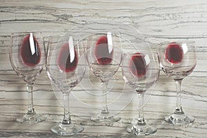 Flat lay background with glasses with red wine on betton background, Concept of winegrowing, winery, winery, wine bar, party