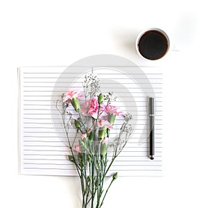 Flat lay: Bible and pink, red, rose flower bouquet. On white background