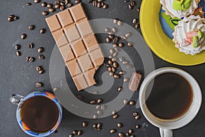 Flat lay of bitten chocolate bar on dark surface f