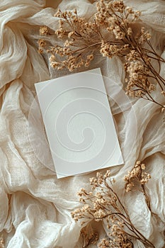 Flat Lay of Blank Art Card with Soft Neutral Textures photo