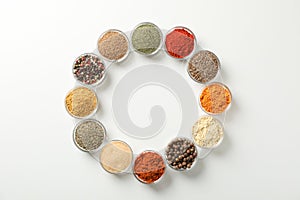Flat lay. Bowls with different spices on white background