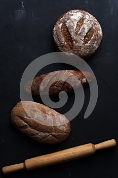 Flat lay bread background. Freshly baked assortment of bread.