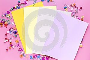 Flat lay of bright colorful sheets of paper notepads