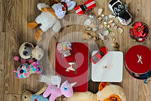 Flat lay of child toys on wooden background. Top view. photo