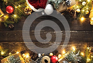 Flat lay Christmas background Frame decoration lights dark wooden background top view