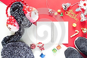 Flat lay of Christmas Decoration gift boxes and empty notebook t