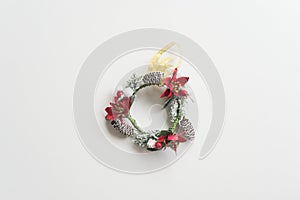 Flat lay of Christmas wreath on white background copy space minimal style. Christmas ornament for decoration in xmas new year