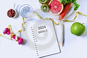 Flat lay of clean eating and exercise for good health, 2024 goal concept. Top view, copy space for text