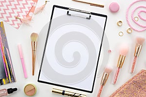 Flat lay clipboard mockup.Composition with cosmetics, makeup tools, on white background pink colors. beauty, fashion