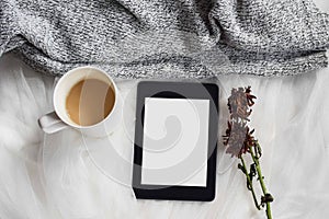 Flat lay of coffee, dried leaves and blank tablet