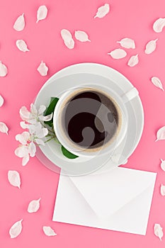 Flat lay of coffee, letter mockup and white petals