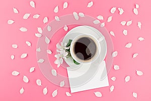 Flat lay of coffee, letter mockup and white petals