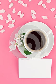 Flat lay of coffee, letter mockup and white petals