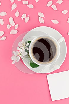 Flat lay of coffee, letter mockup and white petals