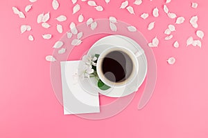 Flat lay of coffee, letter mockup and white petals