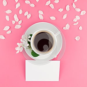 Flat lay of coffee, letter mockup and white petals