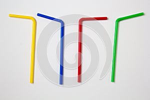 Flat lay of colorful bendy straws isolated on white background