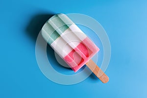 Flat lay of colorful ice cream on the modern rustic on blue background at home office desk wallpaper, top view colorful ice cream