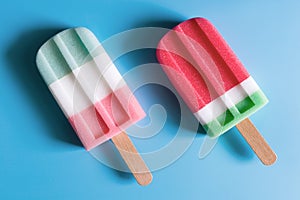 Flat lay of colorful ice cream on the modern rustic on blue background at home office desk wallpaper, top view colorful ice cream