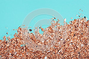 Flat lay of composed miniature of beach lounge area with sea sand and turquoise water