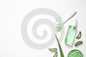 Flat lay composition with aloe vera and cosmetic products on background