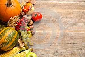 Flat lay composition with autumn vegetables and fruits on wooden background. Happy Thanksgiving day