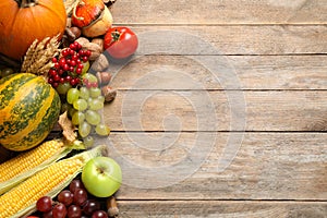 Flat lay composition with autumn vegetables and fruits on wooden background. Happy Thanksgiving day