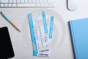 Flat lay composition with avia tickets on white table. Travel agency concept