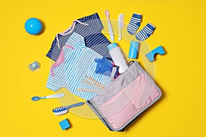 Flat lay composition with baby accessories and maternity bag