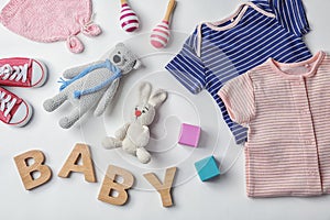 Flat lay composition with baby clothes and accessories photo