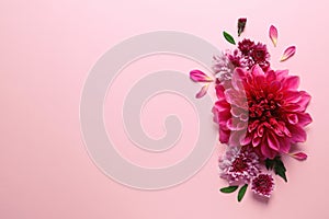 Flat lay composition with beautiful dahlia flowers and space for text