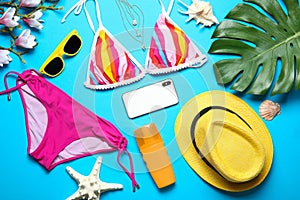 Flat lay composition with bikini, smartphone