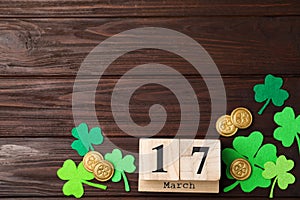 Flat lay composition with block calendar on background, space for text. St. Patrick`s Day celebration