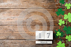 Flat lay composition with block calendar on background, space for text. St. Patrick`s Day celebration
