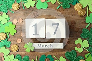 Flat lay composition with block calendar on background. St. Patrick`s Day celebration