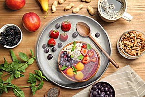 Flat lay composition with bowl of tasty acai smoothie