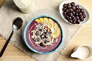 Flat lay composition with bowl of tasty acai smoothie