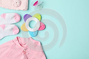 Flat lay composition with child`s clothes and accessories on blue background, space for text