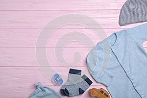 Flat lay composition with child`s clothes on background, space for text