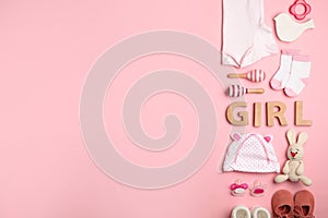 Flat lay composition with child`s clothes and word Girl on background, space for text