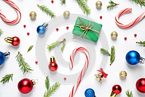lay composition with Christmas gift and festive decor on white background